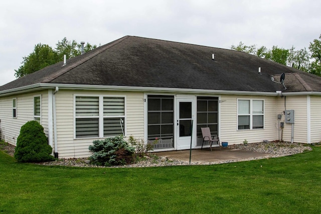204 Coronet St, Angola, IN 46703 - rear view of house with a patio area, a lawn, and roof with shingles