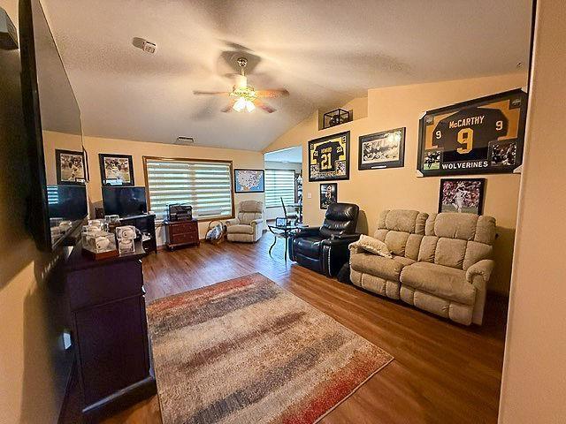204 Coronet St, Angola, IN 46703 - living room with ceiling fan, wood finished floors, and vaulted ceiling