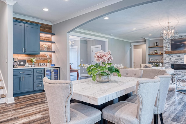 4308 Martha Ct, Newburgh, IN 47630 - dining room with crown molding, wine cooler, recessed lighting, a chandelier, and dark wood-style flooring