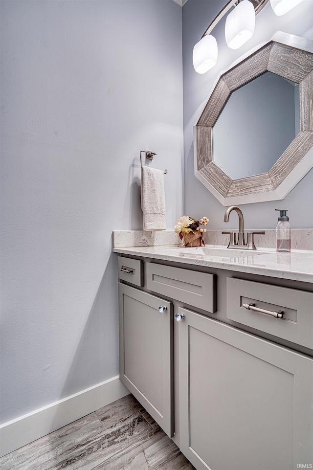 4308 Martha Ct, Newburgh, IN 47630 - bathroom featuring vanity, wood finished floors, and baseboards