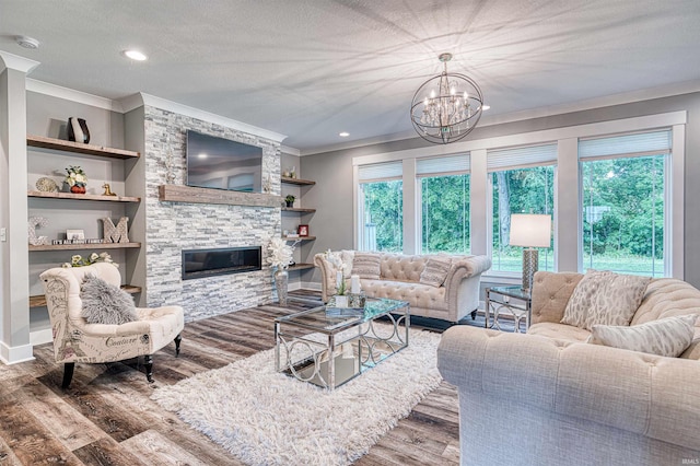 4308 Martha Ct, Newburgh, IN 47630 - living area with crown molding, wood finished floors, a chandelier, a fireplace, and a textured ceiling