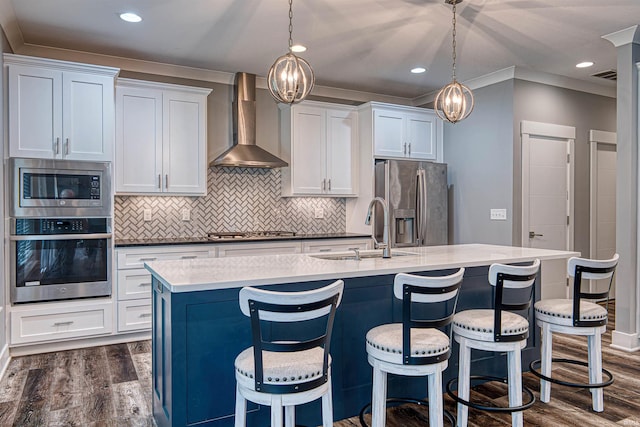 4308 Martha Ct, Newburgh, IN 47630 - kitchen with appliances with stainless steel finishes, wall chimney range hood, a sink, dark wood-style floors, and ornamental molding
