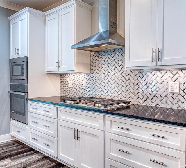 4308 Martha Ct, Newburgh, IN 47630 - kitchen featuring appliances with stainless steel finishes, wall chimney exhaust hood, white cabinets, and backsplash