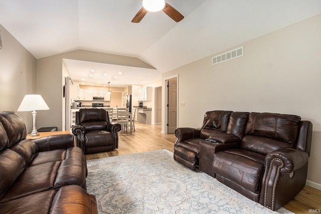 50576 W Park Ln, Granger, IN 46530 - living area with ceiling fan, light wood-style flooring, vaulted ceiling, and baseboards