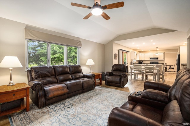 50576 W Park Ln, Granger, IN 46530 - living room with a ceiling fan, lofted ceiling, and light wood-type flooring
