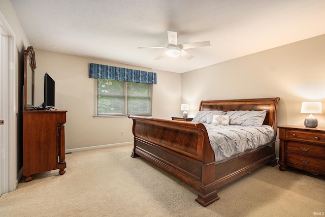 50576 W Park Ln, Granger, IN 46530 - bedroom with light carpet, baseboards, and ceiling fan