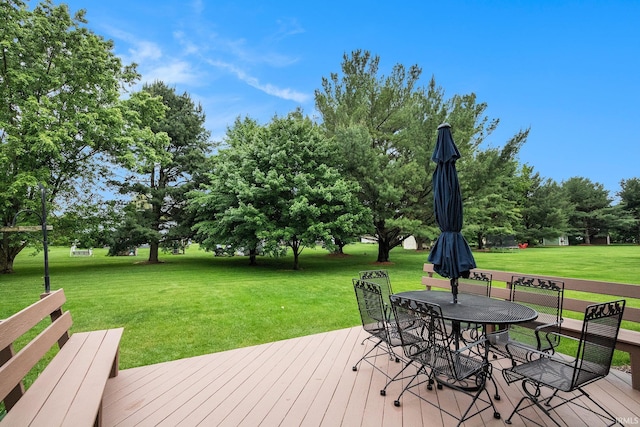 50576 W Park Ln, Granger, IN 46530 - wooden deck featuring a lawn and outdoor dining space