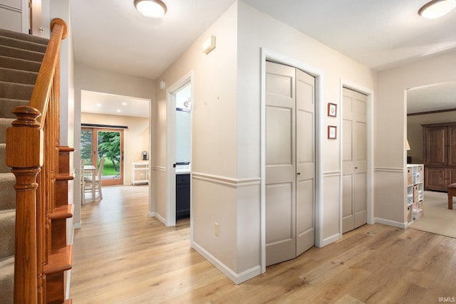 50576 W Park Ln, Granger, IN 46530 - hallway featuring light wood-style floors, stairs, and baseboards