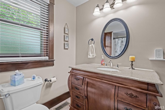 1010 W Sycamore St, Kokomo, IN 46901 - full bathroom with vanity, toilet, and baseboards