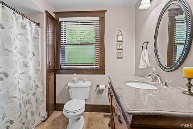 1010 W Sycamore St, Kokomo, IN 46901 - full bath featuring vanity, toilet, tile patterned flooring, curtained shower, and baseboards