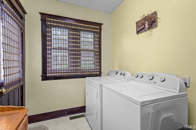 1010 W Sycamore St, Kokomo, IN 46901 - laundry room with washer and clothes dryer and light tile patterned floors