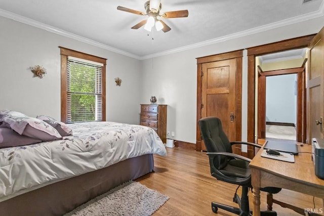 1010 W Sycamore St, Kokomo, IN 46901 - bedroom with light wood-style flooring, crown molding, an office area, ceiling fan, and baseboards