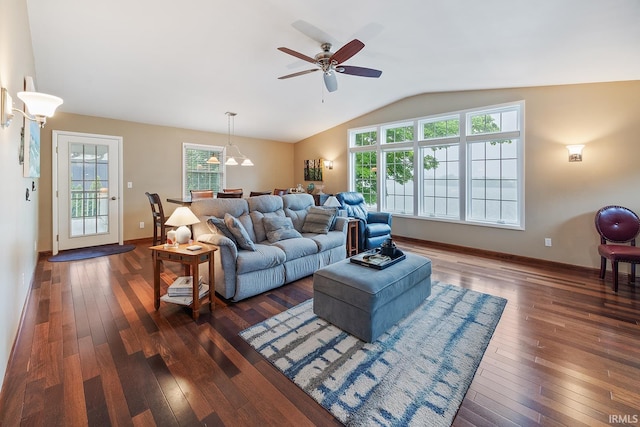 8818 N 1132 W, Monticello, IN 47960 - living room featuring dark wood-type flooring, vaulted ceiling, ceiling fan, and baseboards