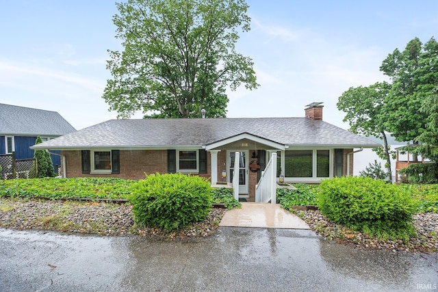 8818 N 1132 W, Monticello, IN 47960 - ranch-style house featuring brick siding, a chimney, and roof with shingles