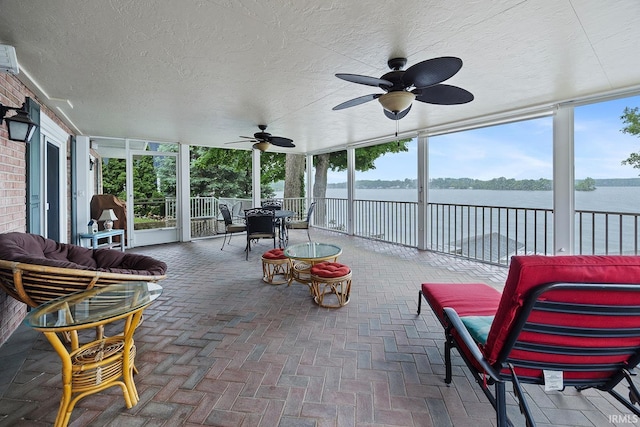 8818 N 1132 W, Monticello, IN 47960 - sunroom / solarium featuring ceiling fan, a water view, and outdoor dining area