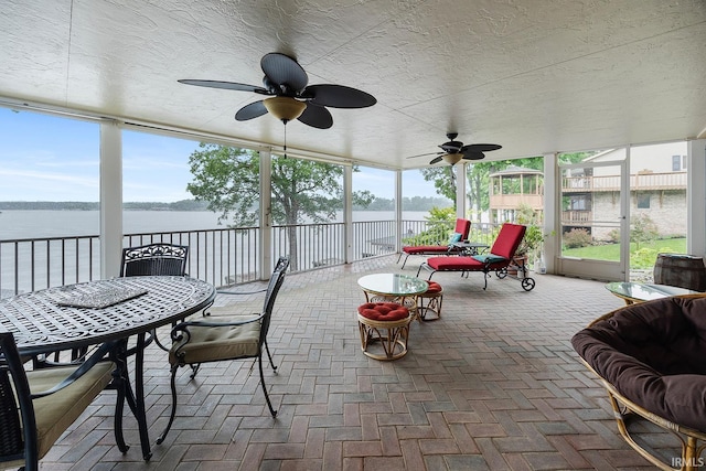 8818 N 1132 W, Monticello, IN 47960 - sunroom / solarium featuring a water view, a ceiling fan, and outdoor dining space