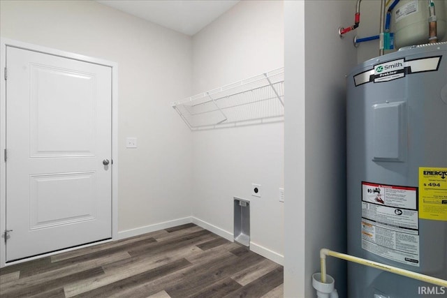 5582 Hillside Trl, Newburgh, IN 47630 - laundry area featuring electric water heater, electric dryer hookup, wood finished floors, and baseboards