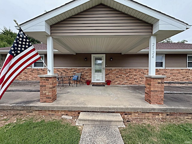 2124 Lakeview Dr, Washington, IN 47501 - view of exterior entry with a porch and brick siding