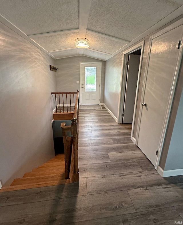2124 Lakeview Dr, Washington, IN 47501 - foyer with wood finished floors, a textured ceiling, vaulted ceiling, and baseboards