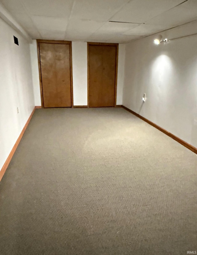 2124 Lakeview Dr, Washington, IN 47501 - finished basement with light carpet, baseboards, and a paneled ceiling