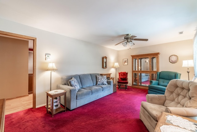 705 W W Spg, Fremont, IN 46737 - living room featuring a ceiling fan and carpet