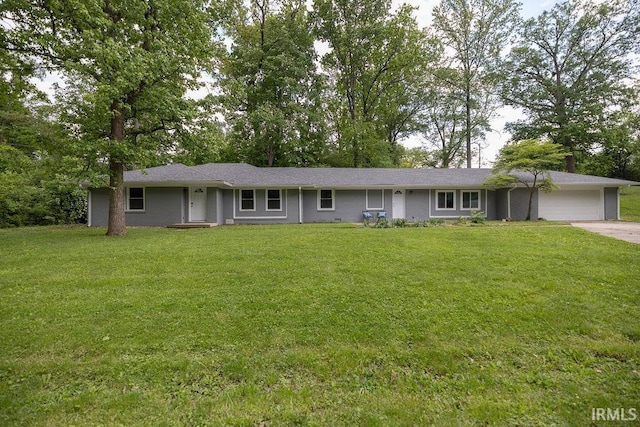 1034 Harter Blvd, Anderson, IN 46011 - ranch-style house featuring a front lawn, a garage, and concrete driveway