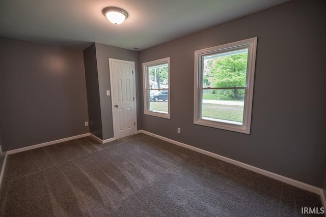 1034 Harter Blvd, Anderson, IN 46011 - empty room with baseboards and dark carpet