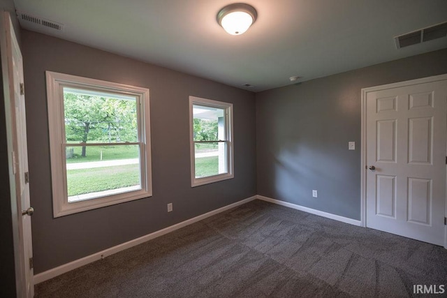 1034 Harter Blvd, Anderson, IN 46011 - empty room featuring baseboards and dark carpet