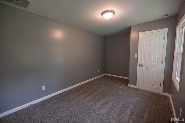 1034 Harter Blvd, Anderson, IN 46011 - unfurnished room featuring dark carpet and baseboards