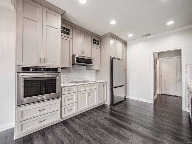 2747 Thornhill Dr, Evansville, IN 47725 - kitchen featuring appliances with stainless steel finishes, crown molding, baseboards, light countertops, and decorative backsplash