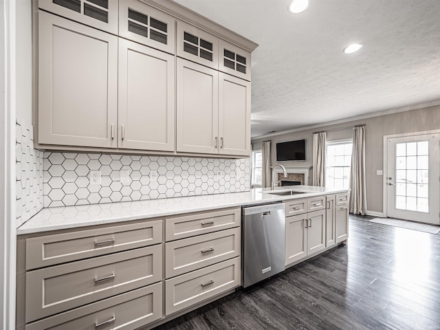2747 Thornhill Dr, Evansville, IN 47725 - kitchen featuring dishwasher, a sink, light countertops, a textured ceiling, and dark wood-style flooring