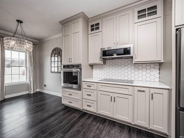 2747 Thornhill Dr, Evansville, IN 47725 - kitchen with appliances with stainless steel finishes, baseboards, light countertops, ornamental molding, and dark wood finished floors