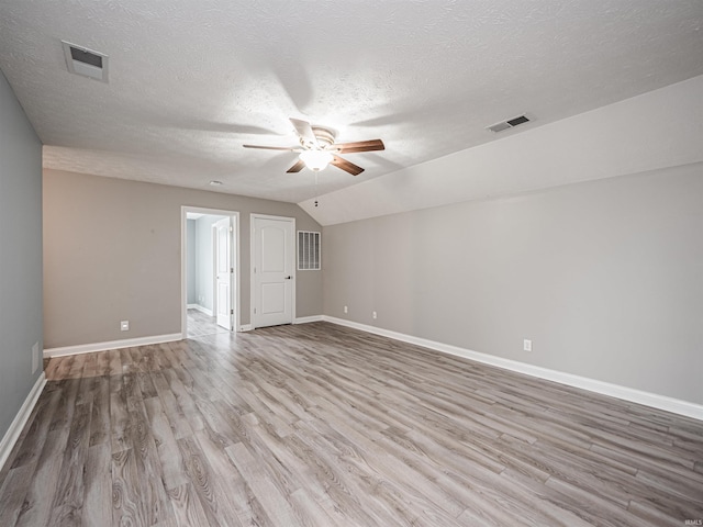 2747 Thornhill Dr, Evansville, IN 47725 - empty room featuring ceiling fan, wood finished floors, a textured ceiling, baseboards, and lofted ceiling