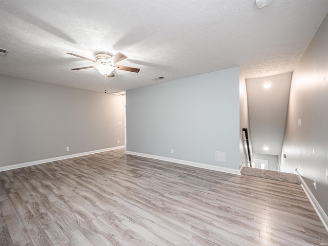 2747 Thornhill Dr, Evansville, IN 47725 - spare room featuring ceiling fan, wood finished floors, a textured ceiling, and baseboards