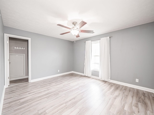 2747 Thornhill Dr, Evansville, IN 47725 - empty room with light wood-style floors, ceiling fan, and baseboards