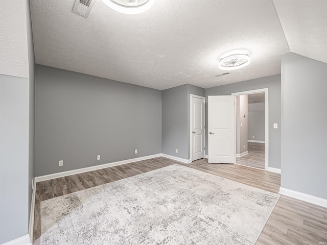 2747 Thornhill Dr, Evansville, IN 47725 - spare room featuring wood finished floors, baseboards, and a textured ceiling