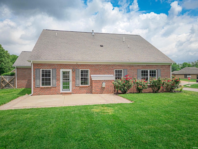 2747 Thornhill Dr, Evansville, IN 47725 - rear view of house with brick siding, a patio area, and roof with shingles