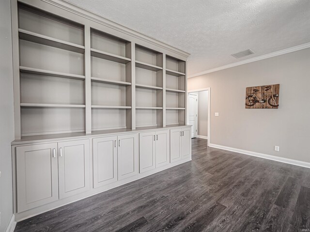 2747 Thornhill Dr, Evansville, IN 47725 - empty room with a textured ceiling, ornamental molding, dark wood finished floors, and baseboards