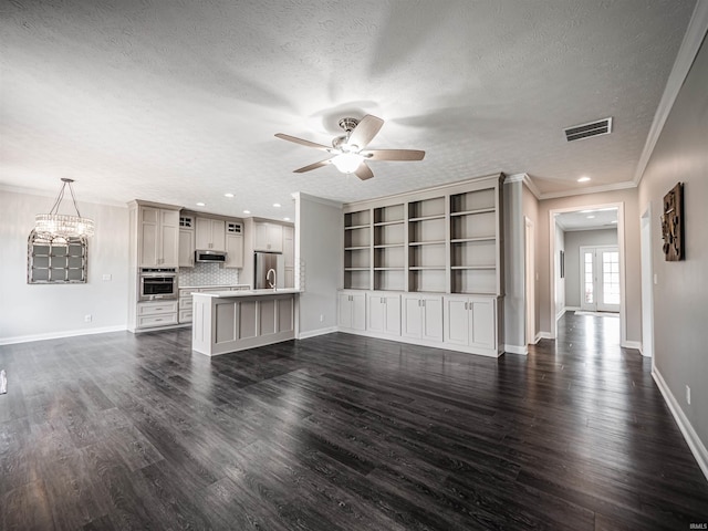 2747 Thornhill Dr, Evansville, IN 47725 - unfurnished living room featuring a ceiling fan, a textured ceiling, dark wood-style floors, crown molding, and baseboards