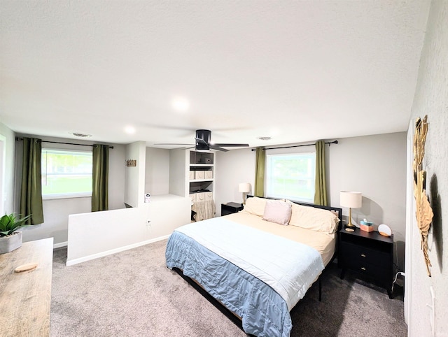 7382 Denise Dr, Fort Wayne, IN 46835 - carpeted bedroom featuring ceiling fan, multiple windows, and baseboards