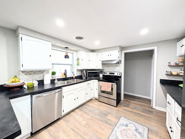 7382 Denise Dr, Fort Wayne, IN 46835 - kitchen featuring stainless steel appliances, under cabinet range hood, a sink, white cabinetry, and recessed lighting