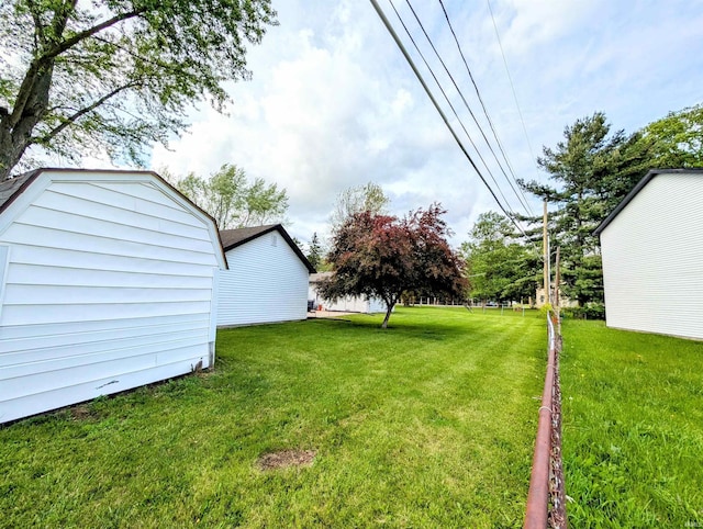 7382 Denise Dr, Fort Wayne, IN 46835 - view of grassy yard featuring an outdoor structure
