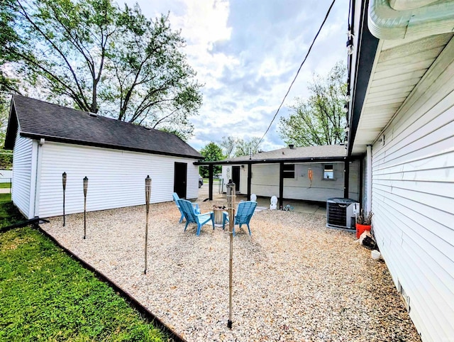 7382 Denise Dr, Fort Wayne, IN 46835 - view of patio with central air condition unit and an outdoor fire pit