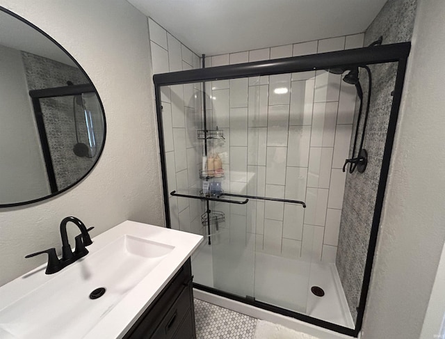 7382 Denise Dr, Fort Wayne, IN 46835 - bathroom with a stall shower, vanity, a textured wall, and tile patterned flooring