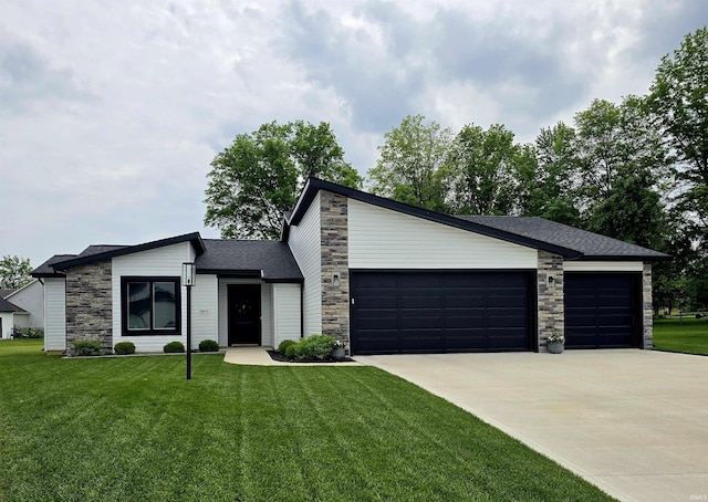 1485 Radomiro Psge, Fort Wayne, IN 46845 - mid-century home with stone siding, a garage, concrete driveway, and a front yard