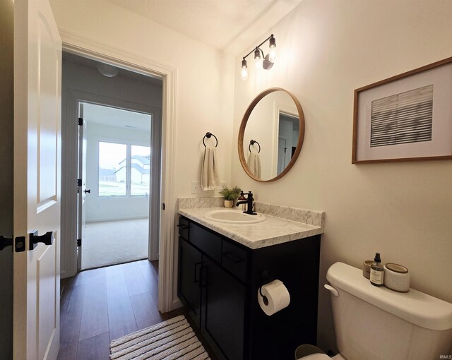 1485 Radomiro Psge, Fort Wayne, IN 46845 - bathroom featuring wood finished floors, vanity, and toilet