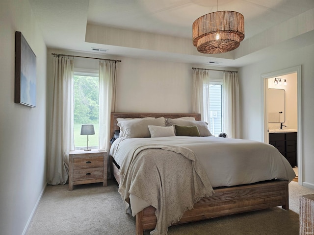 1485 Radomiro Psge, Fort Wayne, IN 46845 - bedroom featuring light colored carpet, multiple windows, connected bathroom, and baseboards