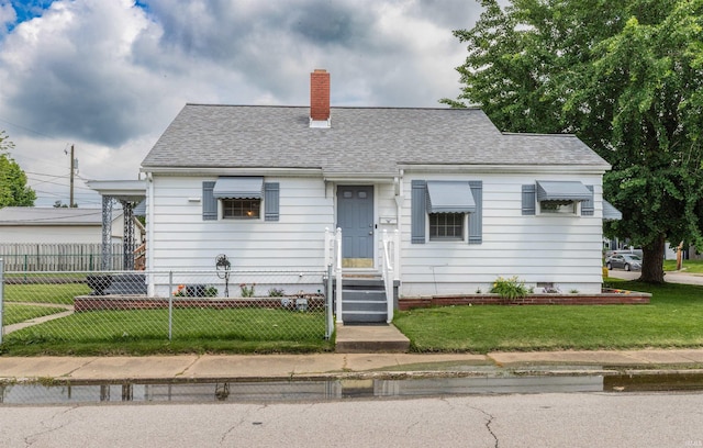 2500 N Govenor St, Evansville, IN 47711 - cape cod home featuring a chimney and a shingled roof