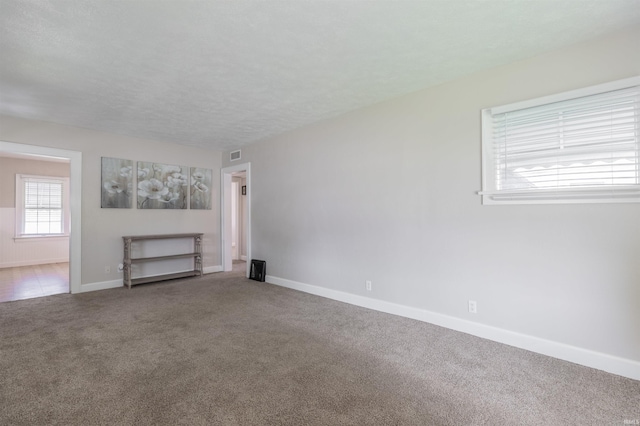 2500 N Govenor St, Evansville, IN 47711 - unfurnished living room with carpet and baseboards