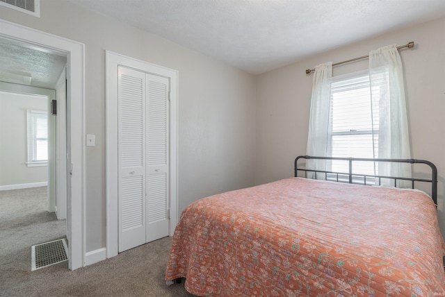 2500 N Govenor St, Evansville, IN 47711 - carpeted bedroom with a closet and baseboards